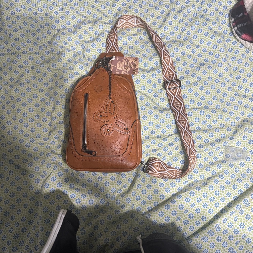 Tan Embossed Leather Crossbody Bag with Patterned Strap